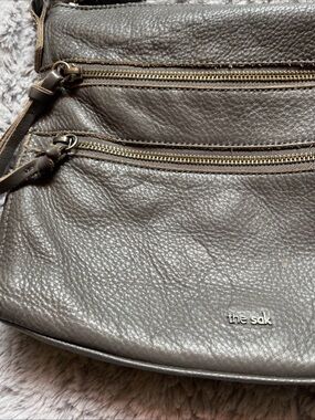 The Sak Metallic Pewter Leather Crossbody Bag with Gold Zippers